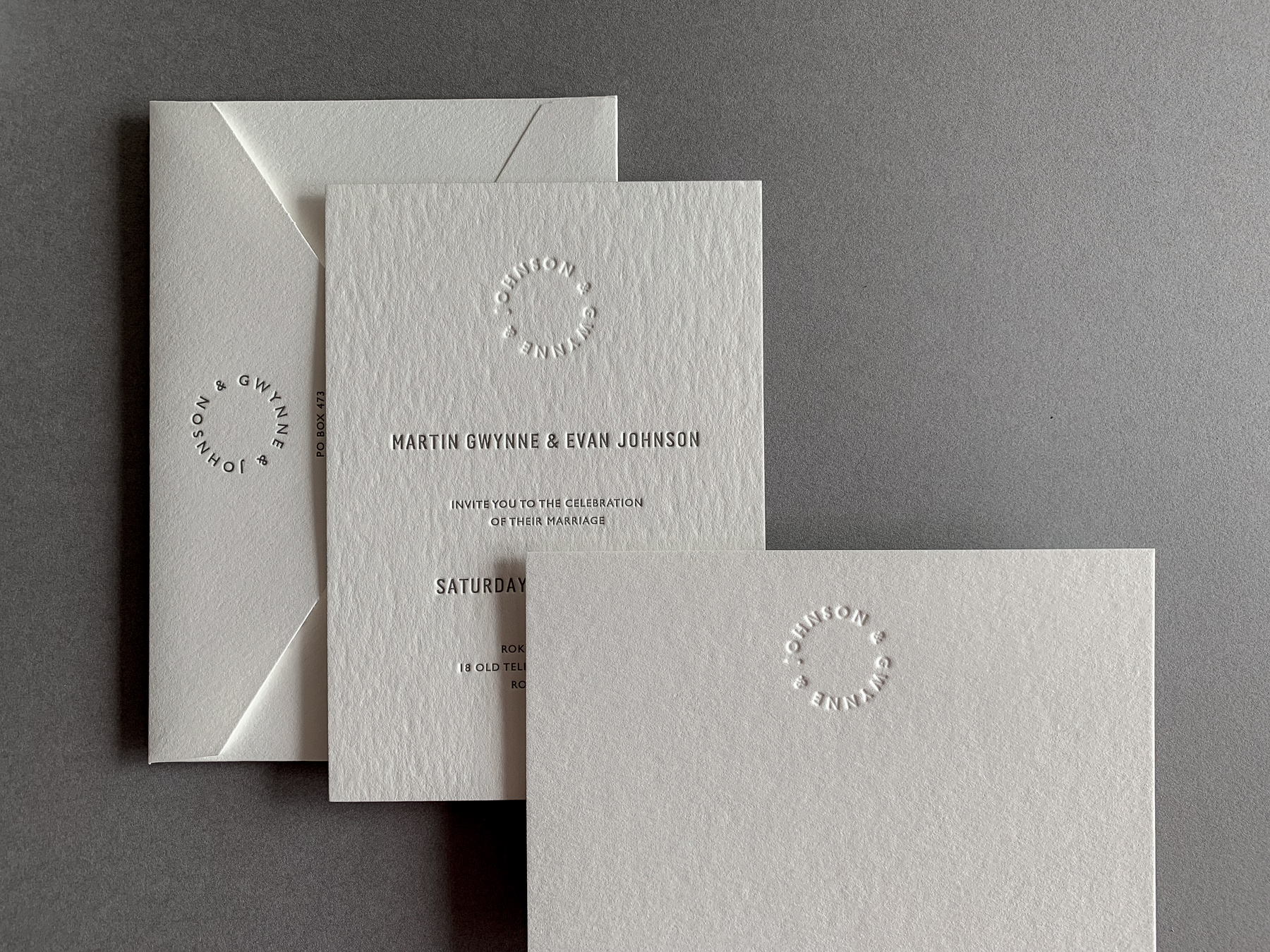 modern-wedding-invitations-letterpress-blind-monogram-evan-and-martin-on-wild-7